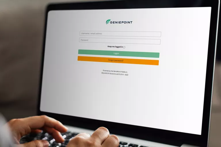 Person using a laptop to login to the GeniePoint Platform