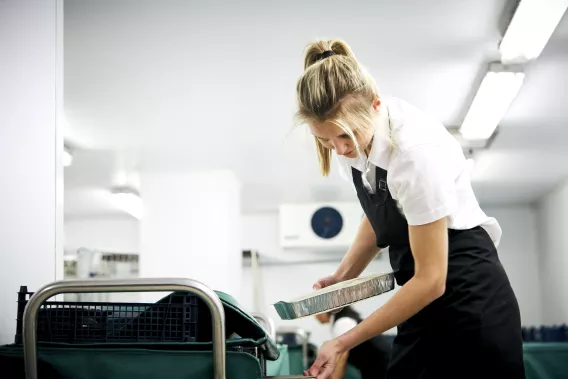 An image of a female caterer at a hospital