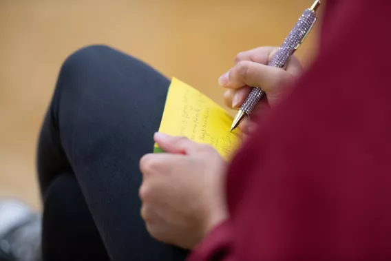 Student writing learnings about air pollution