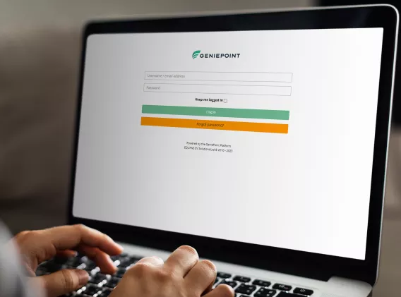 Person using a laptop to login to the GeniePoint Platform
