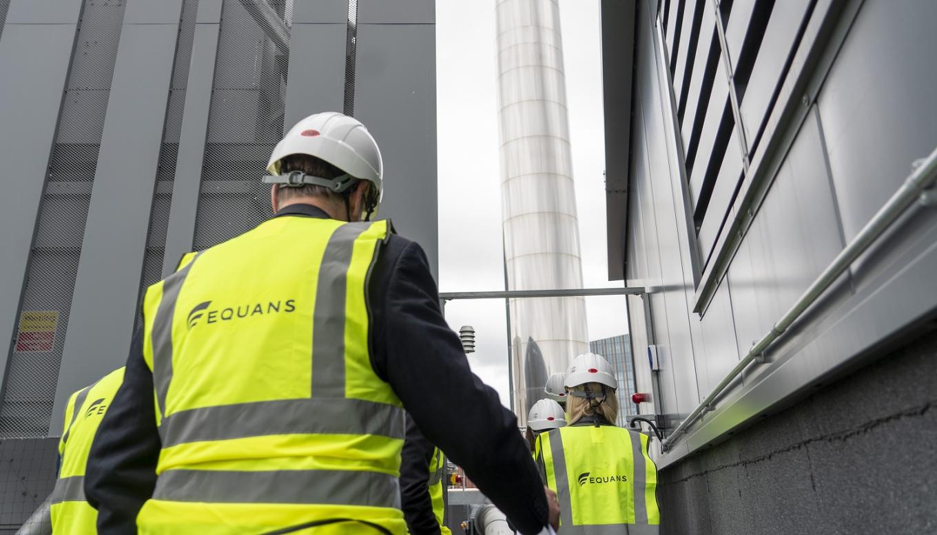 The back of Equans engineers on a site