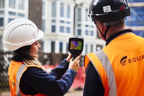 Equans employees undertaking thermal imaging survey on domestic buildings.