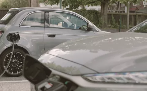 Grey Fiat 500 EV being charged