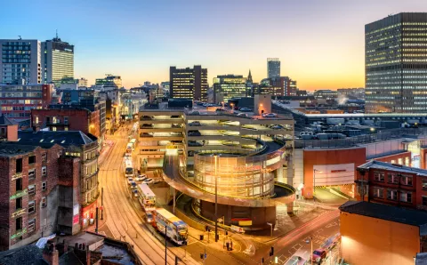 An aerial shot of Manchester by night