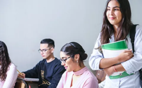 three students - one stood, two sat