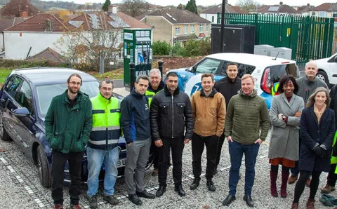 Key stakeholders standing in front of EV charger on Bristol's Revive network
