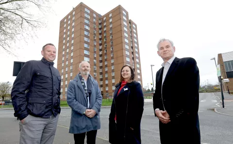 Key stakeholders stood in front of tower block in the West Denton area of Newcastle,