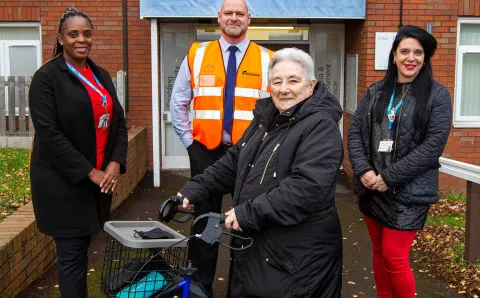 Key stakeholders including a resident outside Woodhouse Court in Dudley