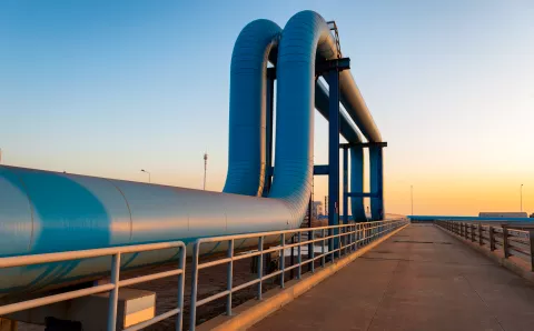Blue pipes going to oil refinery - stock photo