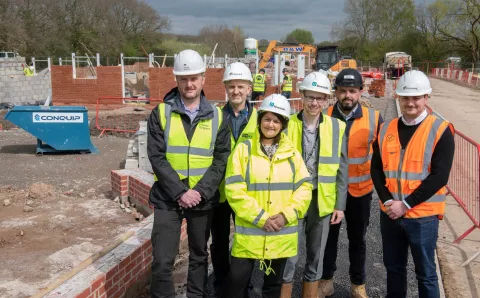Project stakeholders stood in front of a 268-home development located behind the Verdin Exchange in Winsford