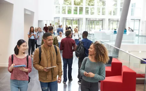 Several students wandering through atrium