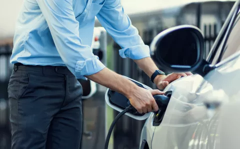 Man charging an EV