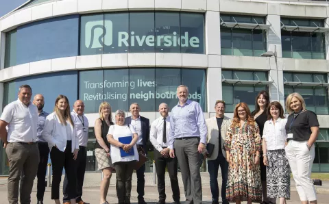 Equans and Riverside staff standing outside Riverside HQ