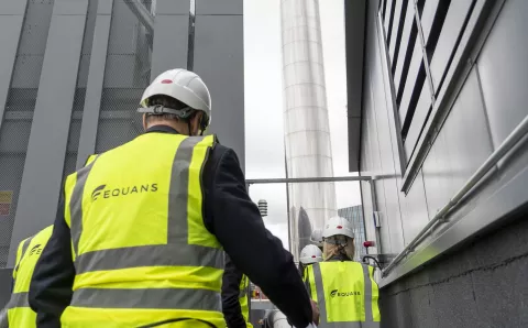 The back of Equans engineers on a site
