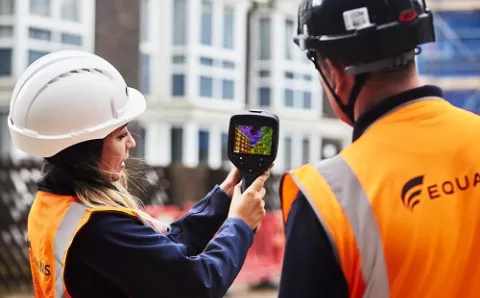 Equans employees undertaking thermal imaging survey on domestic buildings.