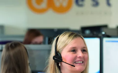 Woman taking calls at Qwest office