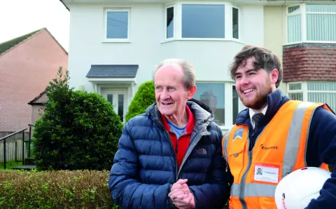 Image of Equans employee shaking hands with resident